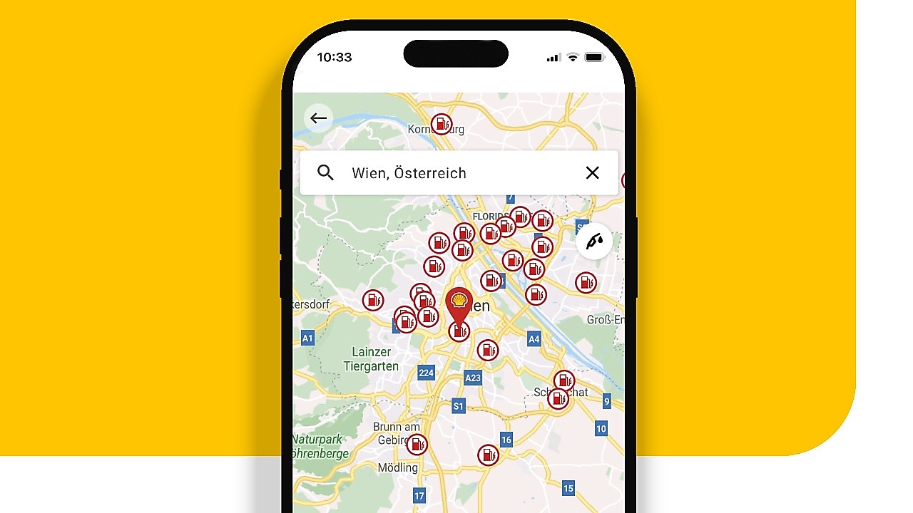 Smartphone mit geöffneter Shell App zeigt Shell Tankstellenfinder.