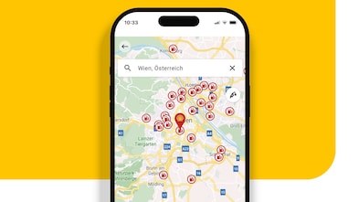 Smartphone mit geöffneter Shell App zeigt Shell Tankstellenfinder.