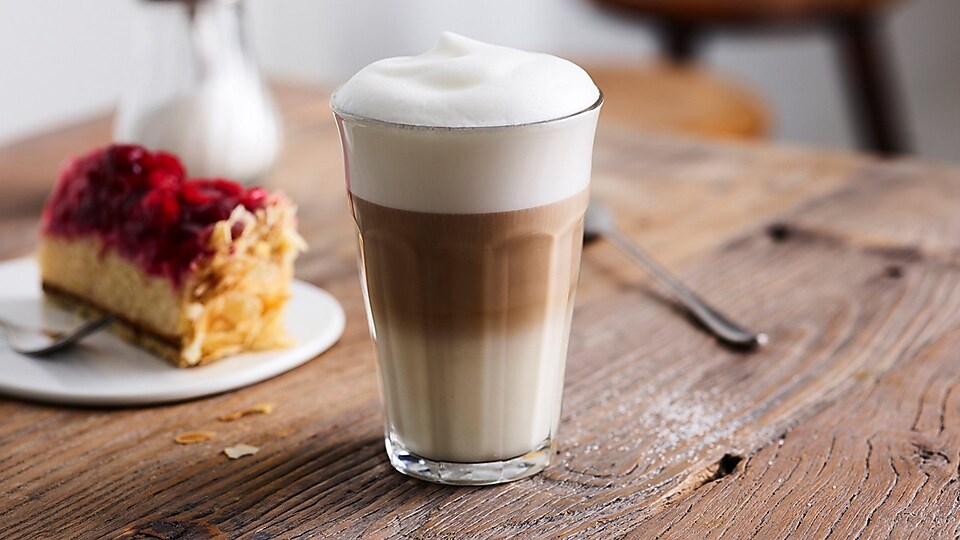 glass-with-latte-macchiato-on-table.jpg